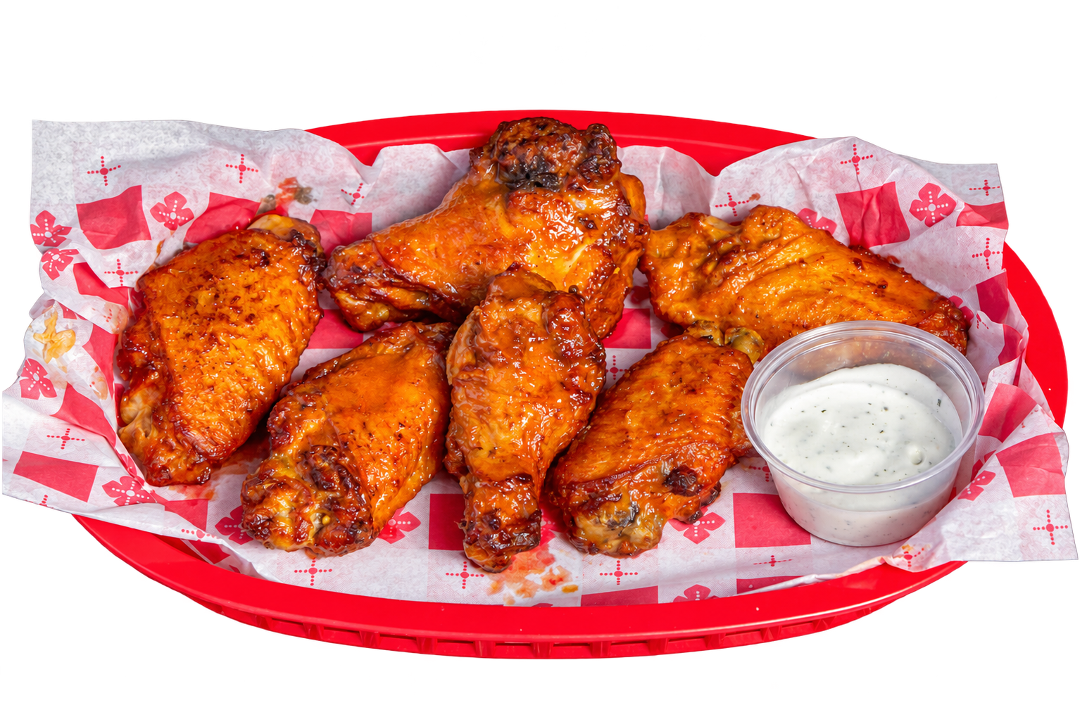 Joe’s Famous Wings with dipping sauce in a red basket